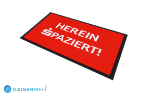 LOGOMATTE LogoMat Express - bedruckte Fußmatte / Teppich in rot mit weißer Schrift "Herein Spaziert!"