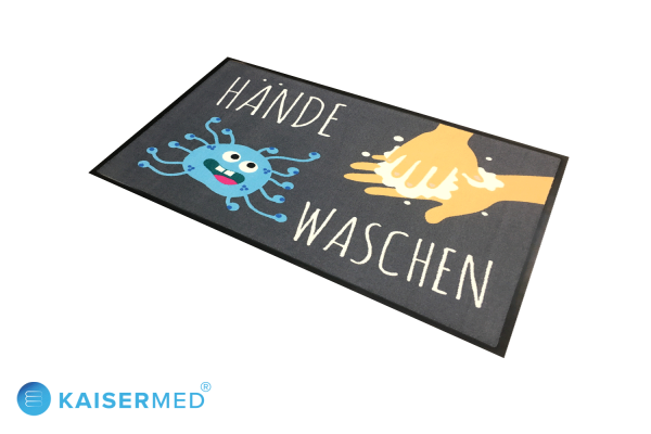 EMCO bedruckte Logomatte mit der Aufschrift "Hände Waschen" dazu ein Cartoon von einem Virus und Hände die sich waschen