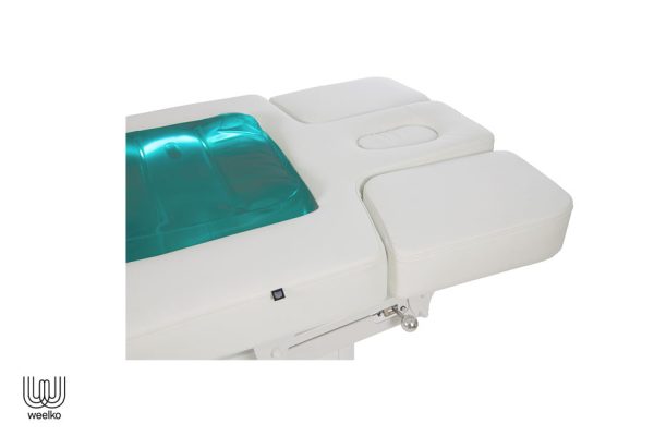 Weiße Massageliege flow, dick gepolstert, mit grünem LED Licht close up vom Kopfteil